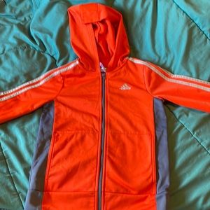 Adidas boys jacket size 7 orange and grey and is made of is polyester